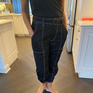 Black with white stitching cotton joggers.